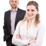 Businesswoman and businessman team portrait.